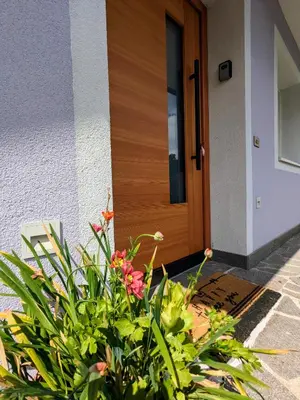 a front door of a house with flowers in front at Casa Lagoraiview in Carano