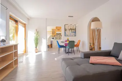 a living room with a couch and a table at A&A Apartments Resort in Bressanone