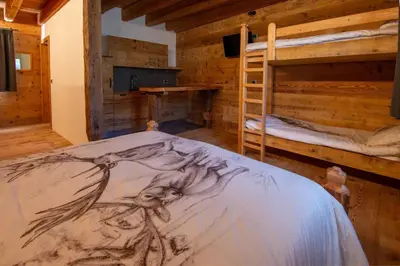 a bedroom with two bunk beds in a cabin at Mas di Siti in Castelfondo
