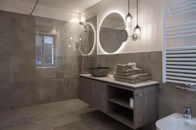 a bathroom with a sink and a mirror at Ansitz Pontegardena in Ponte Gardena