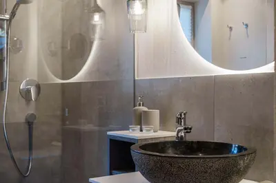 a bathroom with a black sink and a mirror at Ansitz Pontegardena in Ponte Gardena