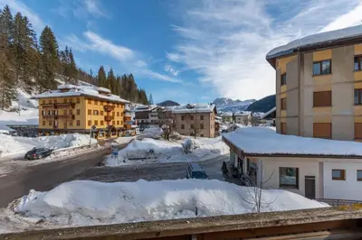arial view of a town with snow covered buildings at Casa Falcade in Falcade
