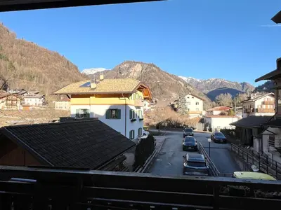 a view of a town with mountains in the background at Appartamento Cuore delle Dolomiti in Cencenighe