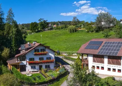 a house with solar panels on the roof at Apartment Schmetterling in Collalbo