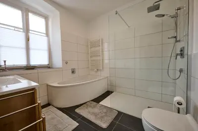a bathroom with a tub and a toilet and a sink at Villa Donata - Luxuriöses & großzügiges Apartment im Herzen von Kaltern, mit Innenhof, kostenlosem Parkplatz direkt am Haus in Caldaro