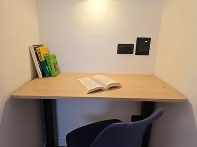 a book sitting on a desk with ainylinylinylinylinylinylinylinyl at Casetta sui Monti - Alpine Stay Apartments in Tesero