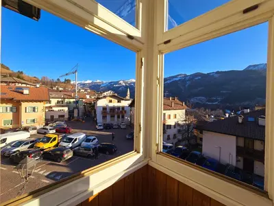 a window with a view of a parking lot at Casetta sui Monti - Alpine Stay Apartments in Tesero
