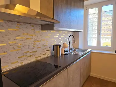 a kitchen with a sink and a counter top at Casetta sui Monti - Alpine Stay Apartments in Tesero