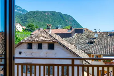 a view of a house from a balcony at Maison sous le ciel in Caldaro