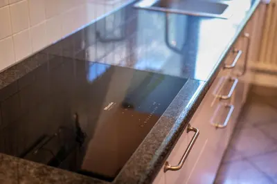a glass counter top in a kitchen at Maison sous le ciel in Caldaro