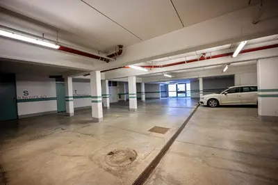 a parking garage with a car parked in it at Residence Petlin Robert in Ortisei