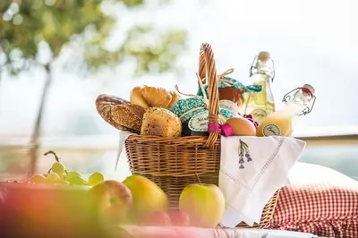 a basket of bread and apples on a table at Ferienwohnung in Schenna mit Bergblick und Pool - Unterpenatz in Schenna