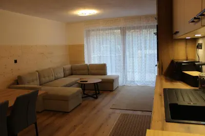 a living room with a couch and a table at Apartment Claudia in Bressanone