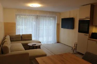 a living room with a couch and a table at Apartment Claudia in Bressanone