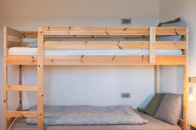 a bunk bed room with two bunk beds at Villa Waldrand with Merano view in Lana