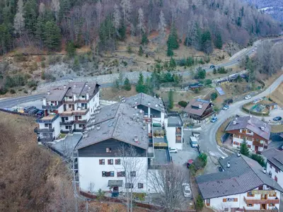 an aerial view of a village with houses and a road at Suite Monte Pelsa in Alleghe