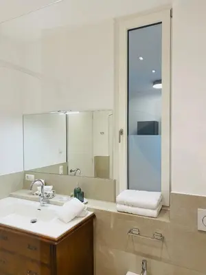 a bathroom with a sink and a mirror at Amort Suites Meran in Merano