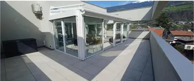 an empty balcony of a house with glass at Vista Dolomiti in Bressanone