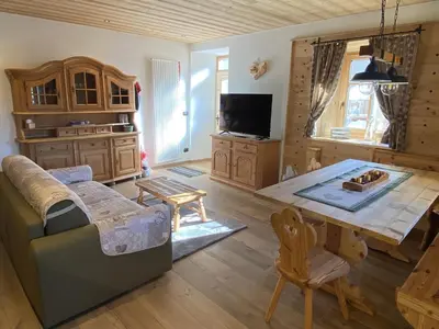 a living room with a couch and a table at Ai Vòlti in Cavalese