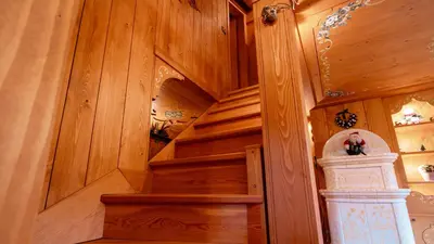 a staircase in a home with wooden walls at Elegante Attico a San Vito in San Vito di Cadore