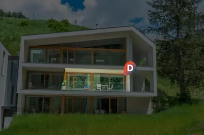 a house with a letter d on the side of it at Apartments Greva 2 in Santa Cristina in Val Gardena