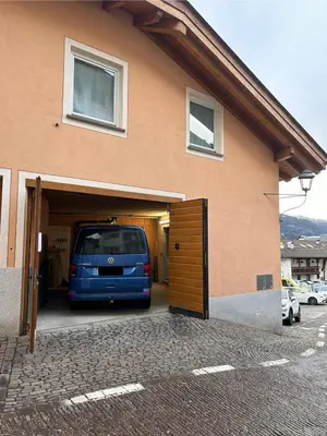 a van is parked inside of a garage at Casa Franz in Tesero
