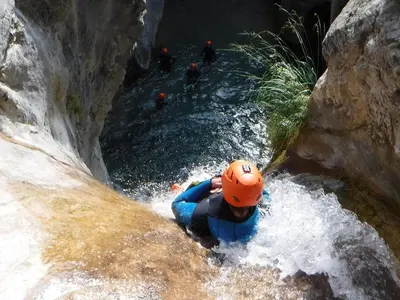 a person rafting down a river in a waterfall at SISSI MENDEL Residence in Ronzone