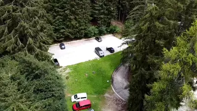 an aerial view of a parking lot with parked cars at SISSI MENDEL Residence in Ronzone