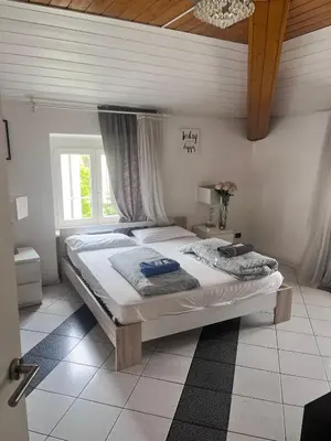 a bedroom with a large bed in a room at Druso Rooms in Bolzano