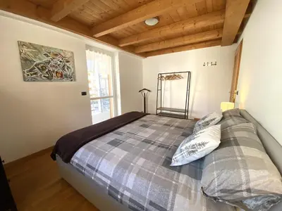a bedroom with a bed in a room at Casa LaLu in Cavalese