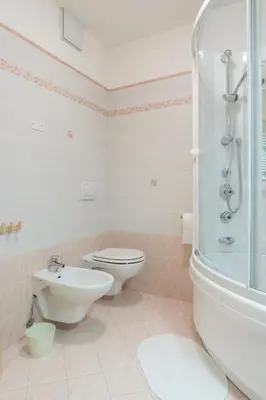 a bathroom with a washing machine and a sink at Dolomites with Love in Mazzin