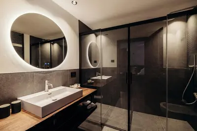 a bathroom with a sink and a shower at Hotel Else in Selva di Val Gardena