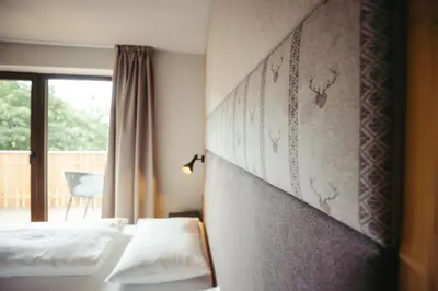 a hotel room with two beds and a window at HoferVals in Valles