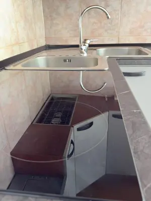 a small kitchen with a sink and a sink at AlpinVista- Le Maddalene in Cavareno