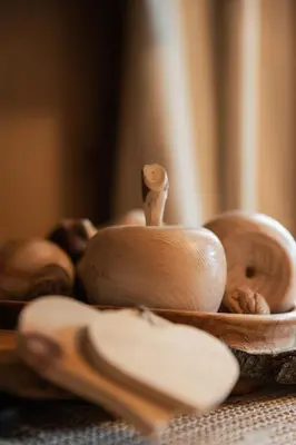 a wooden mortar and pestle sitting on top of a table at Ciasa Ilda - Charming house 120 m2 in La Valle