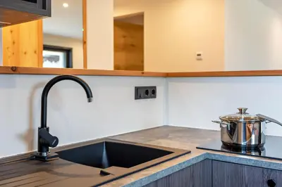 a kitchen counter with a sink and a mixer at Villa Lara Laerche in Castelrotto