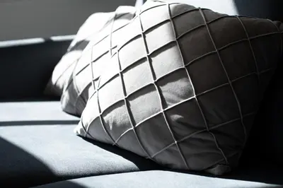 a group of brown and white ties sitting on a couch at Apartment Chiusa in Chiusa