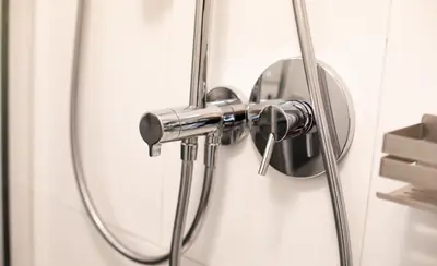a shower handle on a bathroom door at Apartment Chiusa in Chiusa