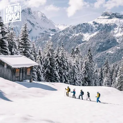 a group of people skiing down a snow covered mountain at Appartamenti Pra Fiorì in Vigo di Fassa