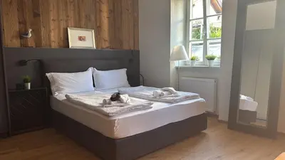 a bedroom with a bed with two stuffed animals on it at Heart of Bolzano in Bolzano