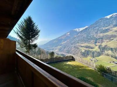 a balcony with a view of a valley and mountains at Haslingerhof - Ferienwohnung Ortler in Saltusio