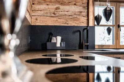 a kitchen with a sink and a counter top at La Mendola Alm-Chalet in Mendola