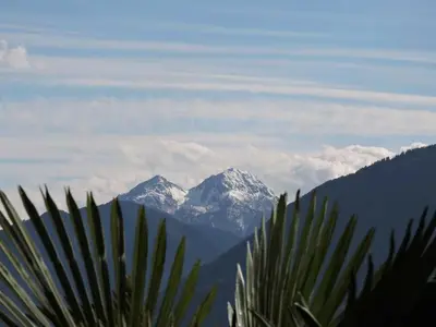a view of a snow covered mountain in the distance at Platterhof in Tirolo