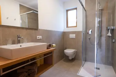 a bathroom with a sink and a shower at Appartements St Urban in Cornaiano