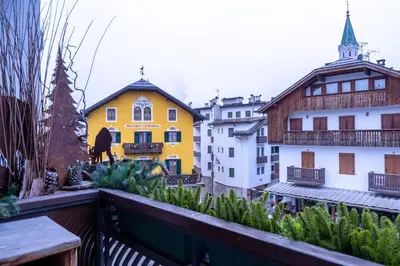 a view from the balcony of a building at Cortina City Center Alpine Apartment with Private Garage in Cortina dʼAmpezzo