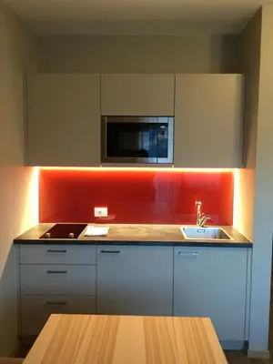 a kitchen with a sink and a microwave at Ruster Resort in Lagundo