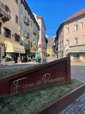 a sign in the middle of a street with buildings at SASS MAOR 2 bedrooms apartment 80 sm Fiera di Primiero TN in Fiera di Primiero