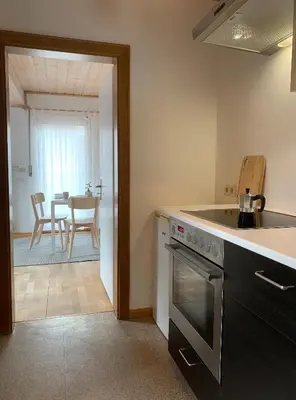 a kitchen with a sink and a stove top oven at Haus Stadler in Naturno