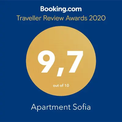a yellow circle with the in the center at Apartment Sofia in Mühlbach