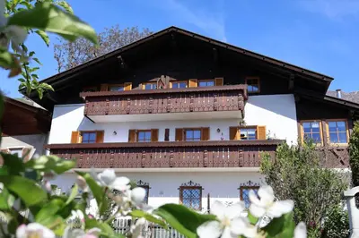 a white building with a brown roof at Oberortsgut in Tirolo